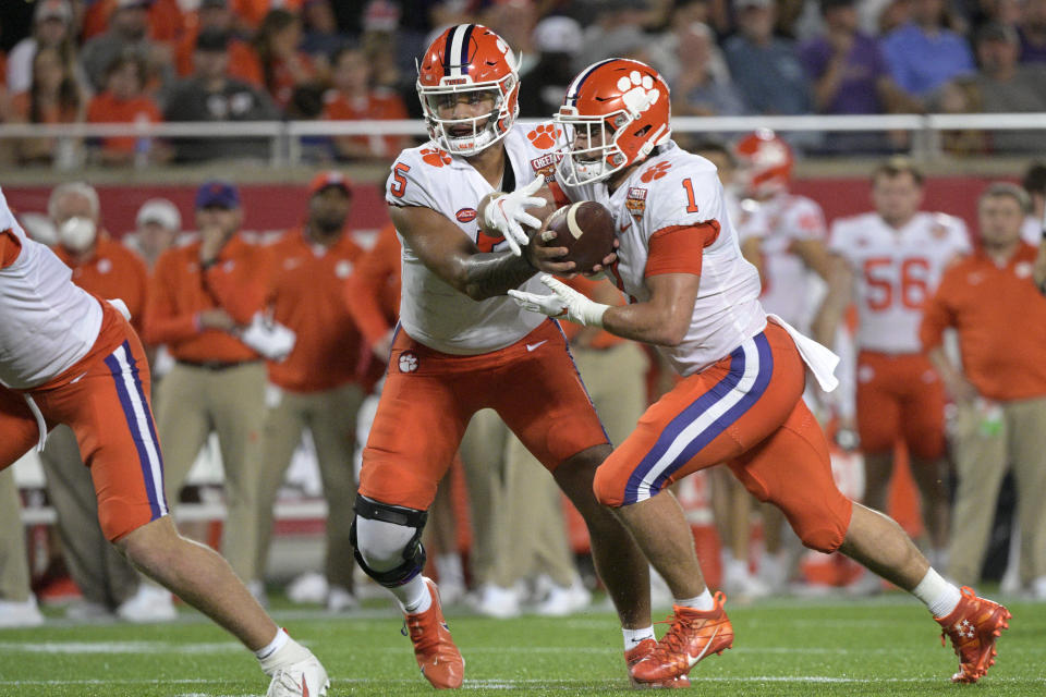 Clemson quarterback D.J. Uiagalelei, left, and running back Will Shipley, right, are looking to take a big leap after the team struggled offensively for much of 2021. (AP Photo/Phelan M. Ebenhack)