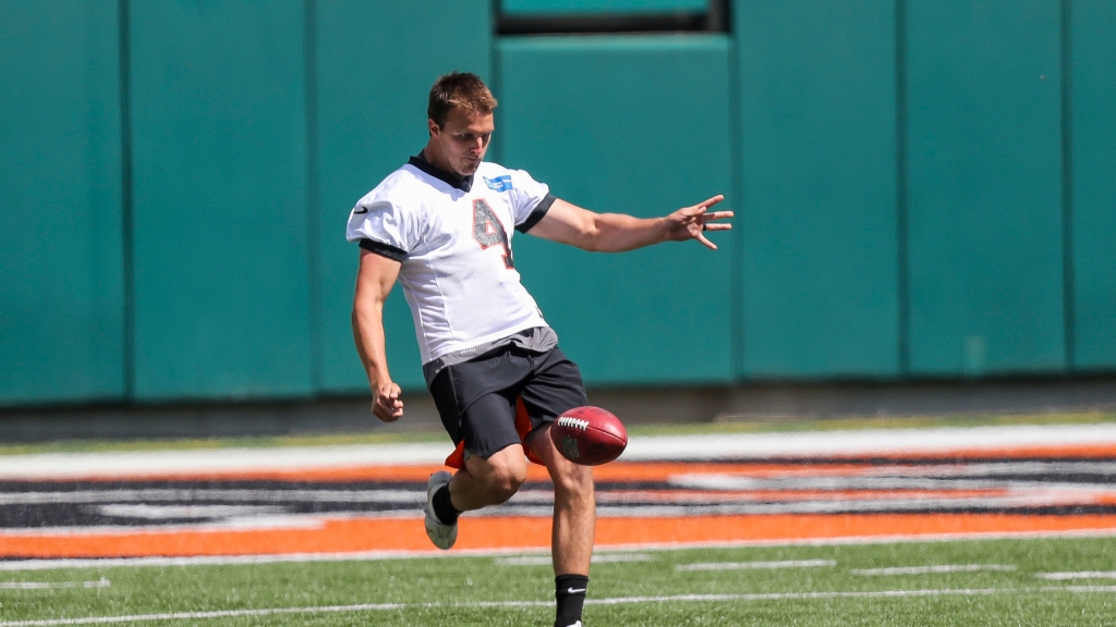 Bengals punter Drue Chrisman taking ground in battle with Kevin Huber