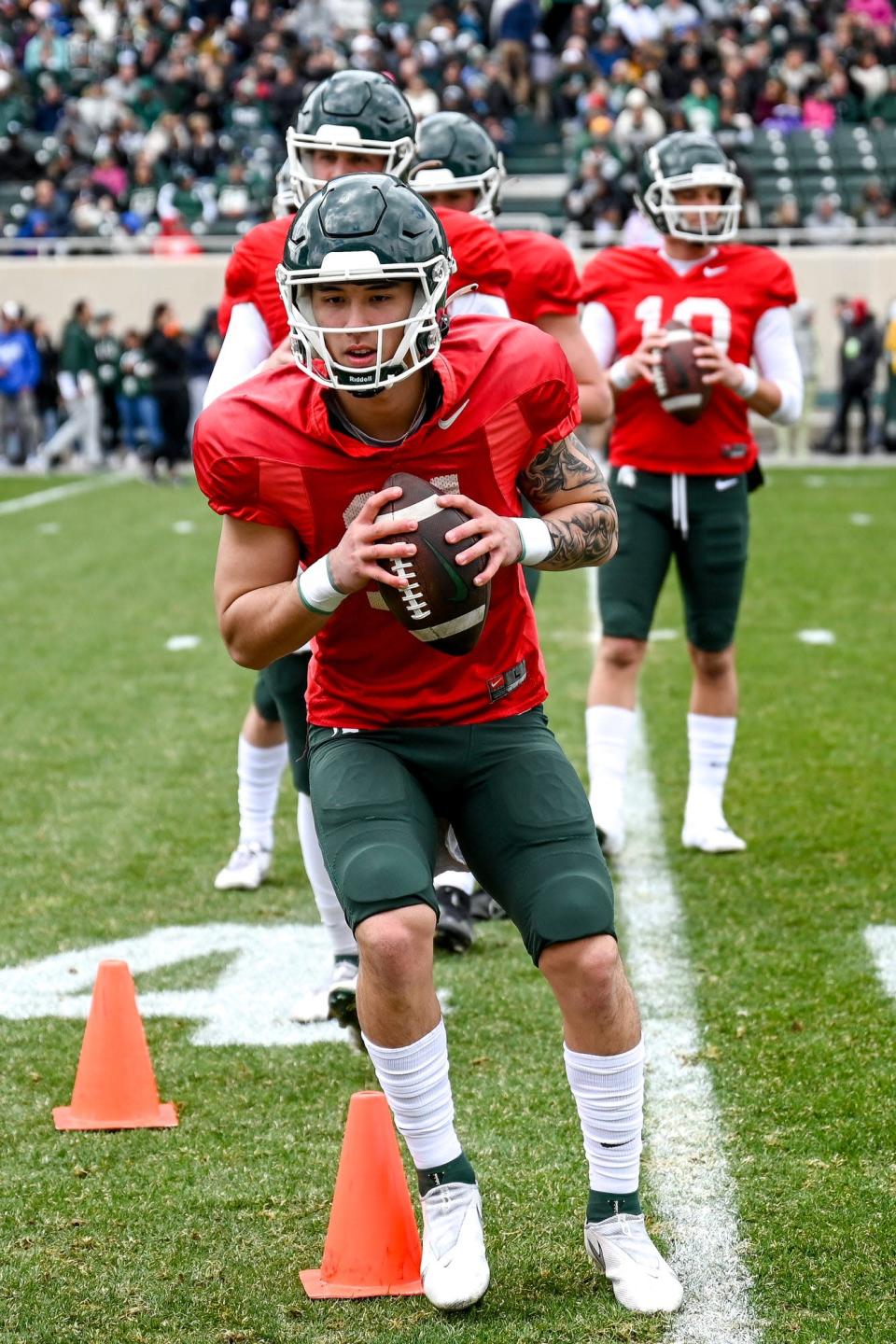 Michigan State's Noah Kim runs a drill with the quarterbacks during the spring game on Saturday, April 16, 2022, at Spartan Stadium in East Lansing.