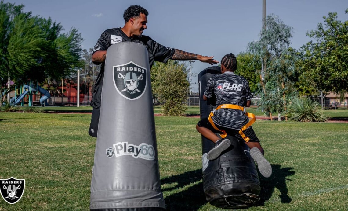 Raiders work with youth at flag football camp