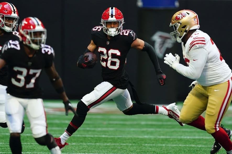 Atlanta Falcons cornerback Isaiah Oliver (26) runs the ball after intercepting a pass during an NFL football game against the San Francisco 49ers Sunday, Oct. 16, 2022, in Atlanta. (AP Photo/John Bazemore)