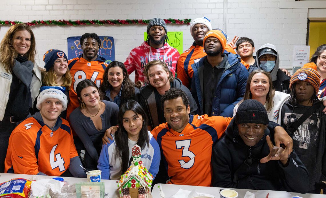 Broncos players visit Urban Peak for holiday celebration and make gingerbread houses