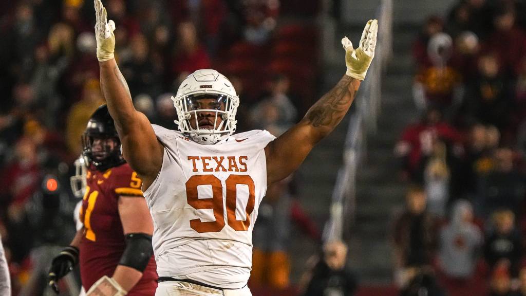 Texas players respond to Iowa State’s Jarrod Hufford after the win