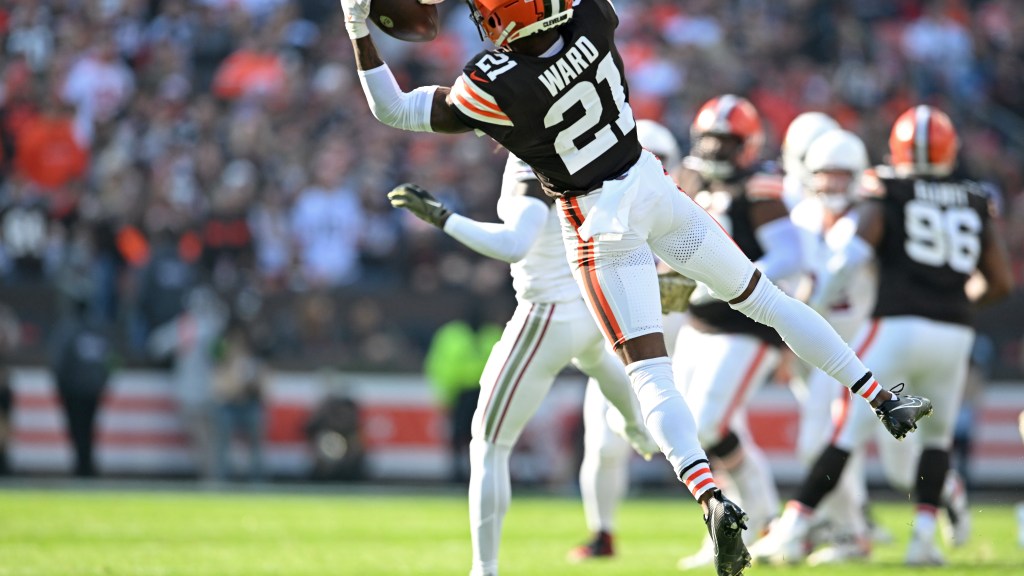 Denzel Ward gives a fan a souvenir at Guardians game Tuesday