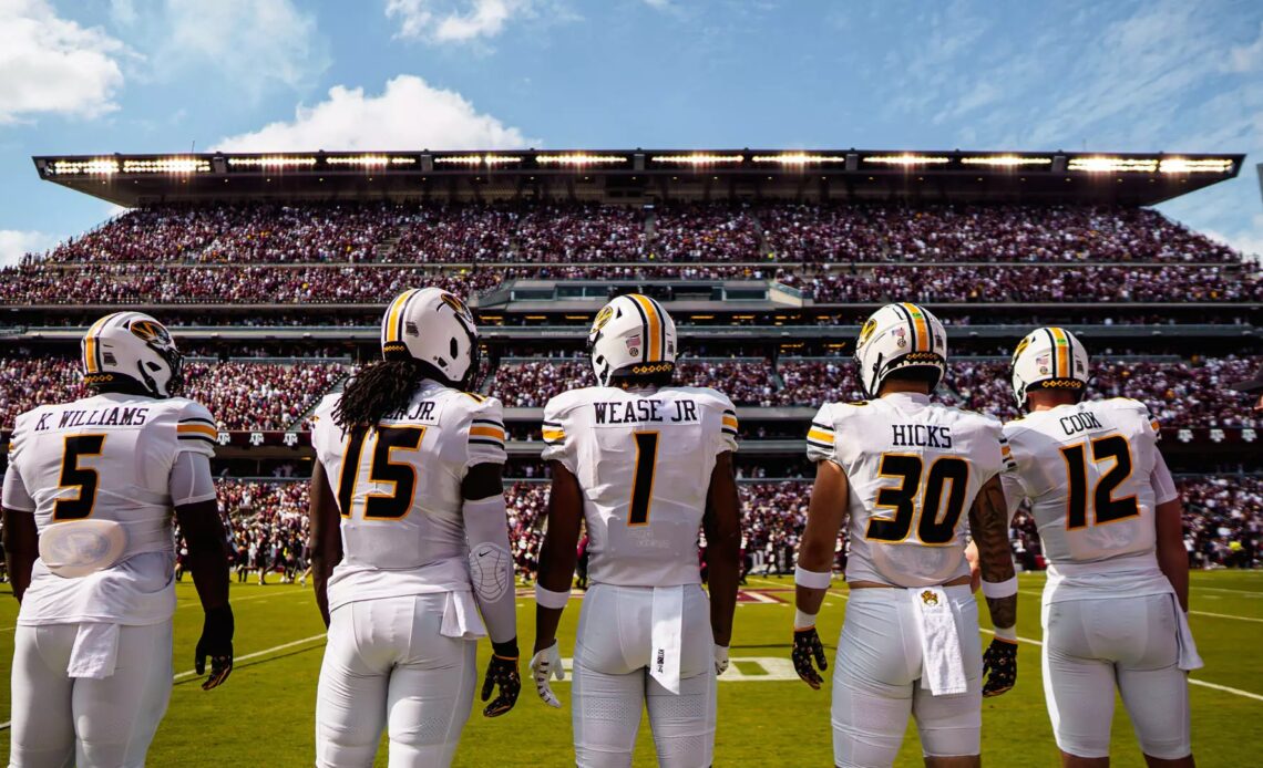 Missouri's team captains walk out to midfield